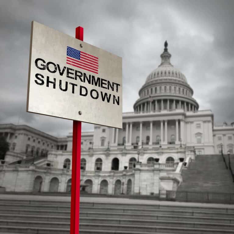 United States government shutdown and american federal shut down due to spending bill disagreement as a national finance symbol with 3D illustration elements.