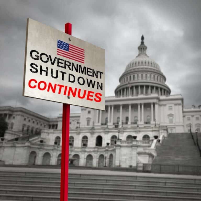 Sign outside capital building saying Government Shutdown Continues
