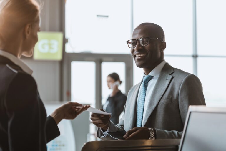 smiling business man at airport on a business trip